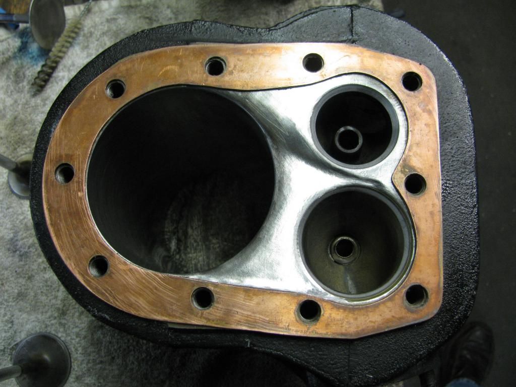 After removal of ceramic and additional relief between intake seat and rear head bolt, and lower spillway into cylinder.  Ceramic in ports, on valves and piston crown only photo IMG_2536.jpg
