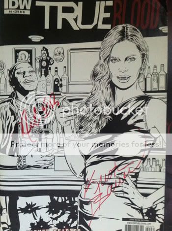 Kristin Bauer van Straten and Nelsan Ellis signed the cover of the